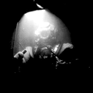 Cover of the track Abyssal showing a deep sea diver.